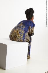 Dina Moses African Woman Sitting Pose